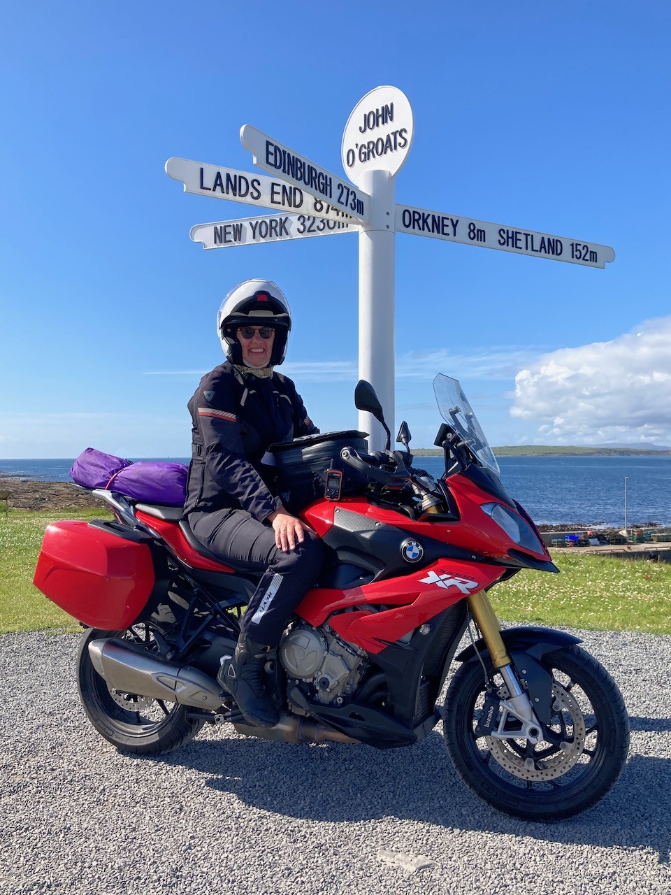 Rachel on her motorbike at the very north of Scotland