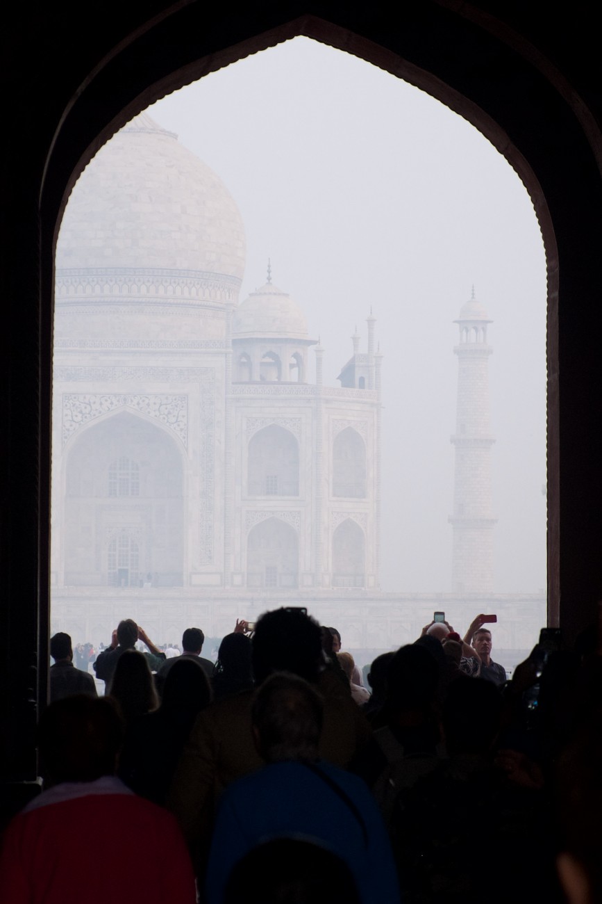 Looking through an archway at the Taj Mahal